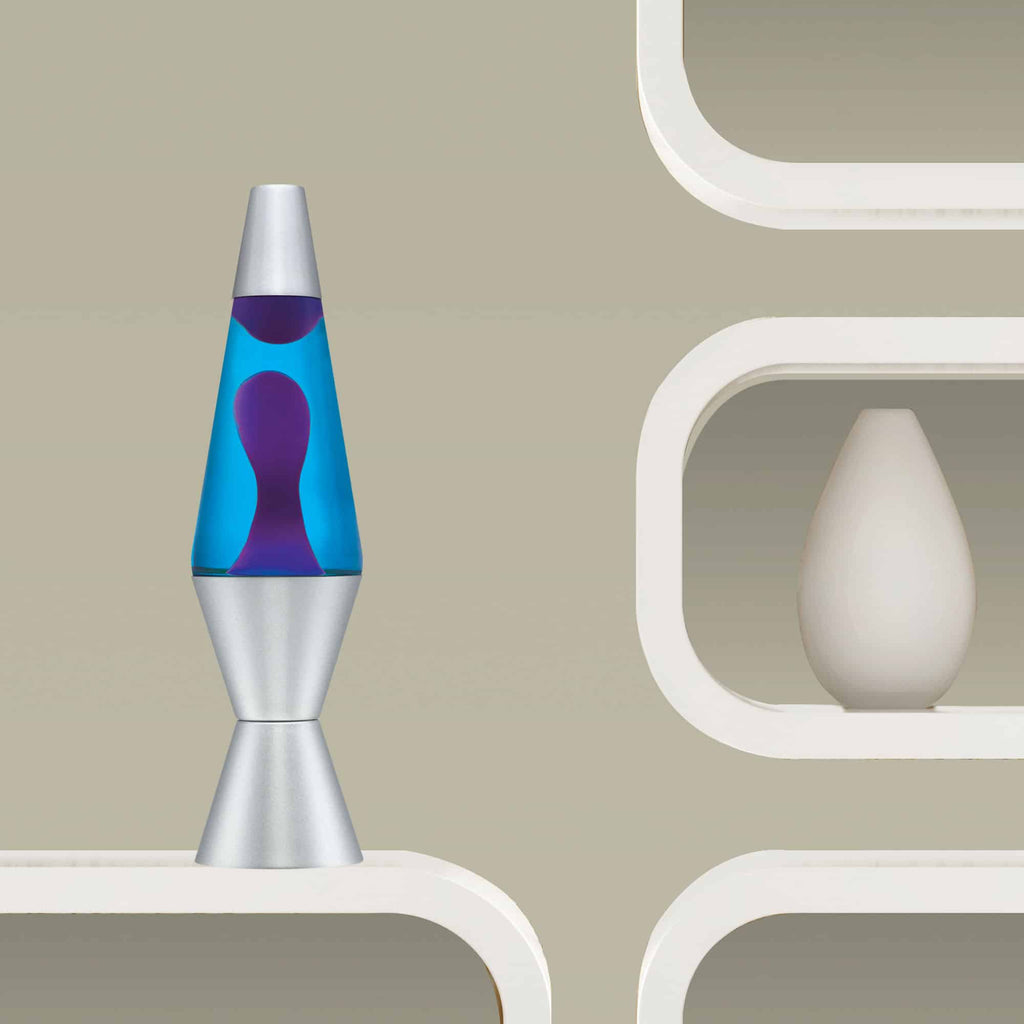 14.5” LAVA® Lamp – Purple/Blue/Silver on a shelf